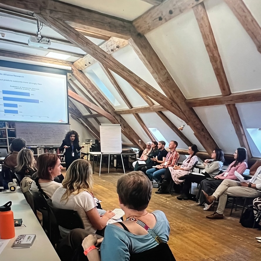 Dr. Joan Neehall presenting the RESTORE-FLOURISH framework at the EBTA conference in Olomouc, Czech Republic."